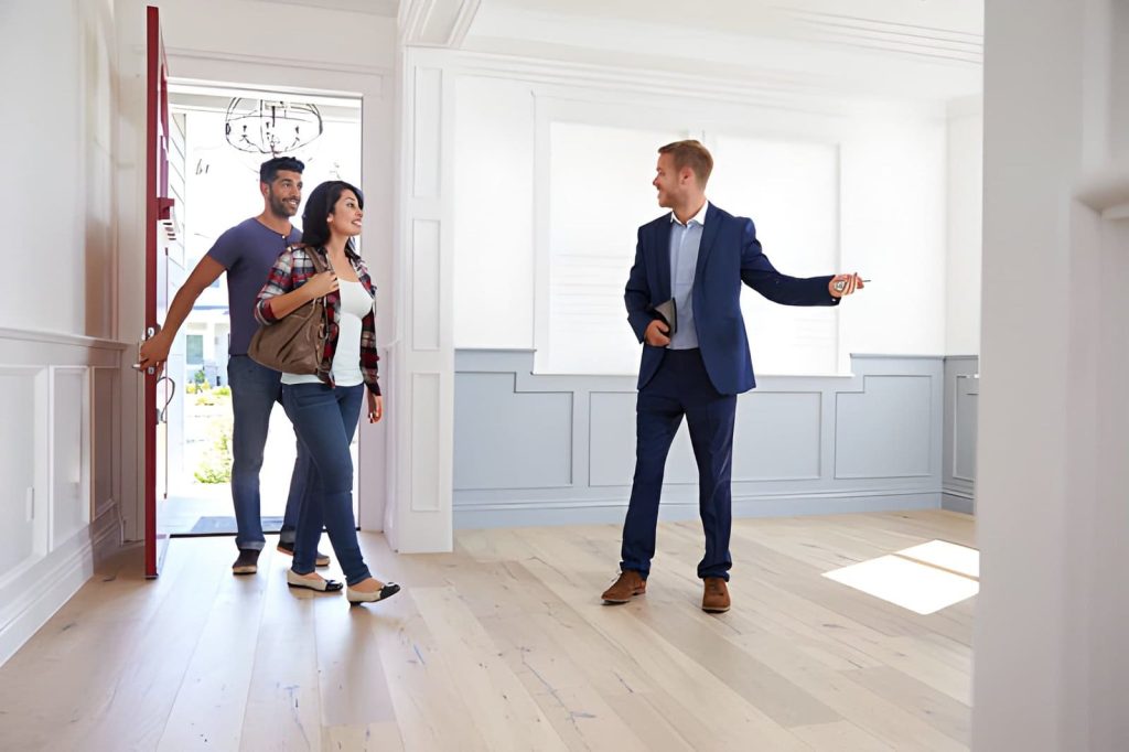 Property watch Palm City professional guiding clients during home tour and inspection for secure investment.